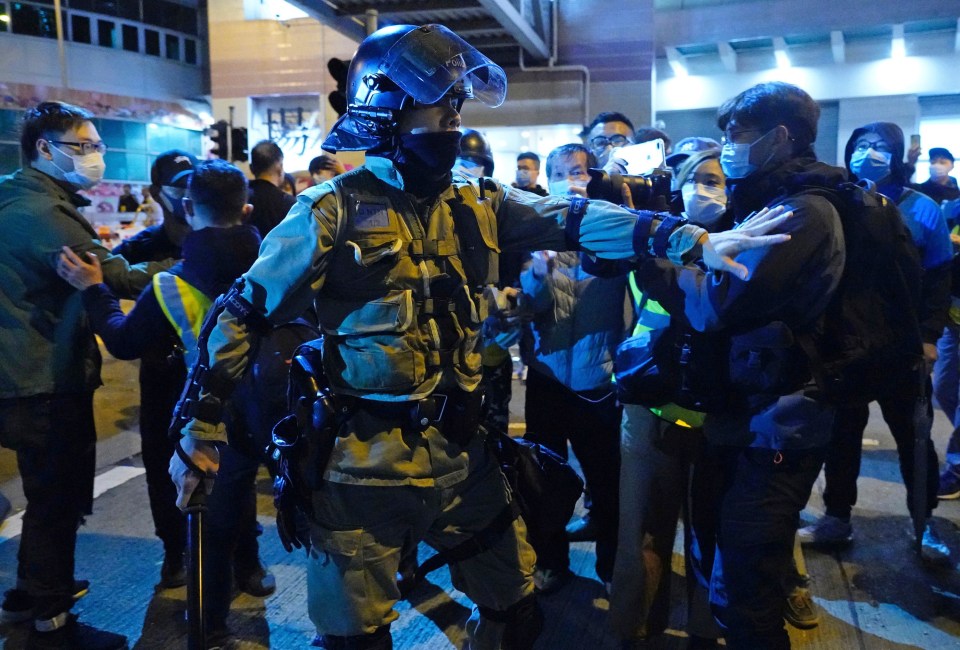  Concerned local residents tussle with riot police on the Fai Ming Estate