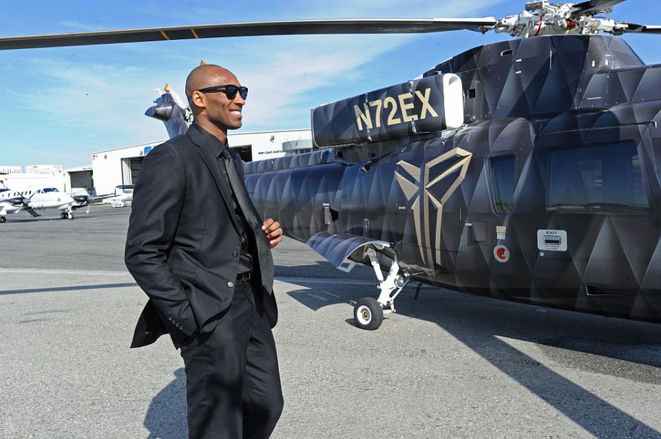 Kobe Byrant with his helicopter which crashed on Sunday