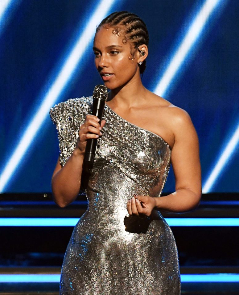  The 15-Grammy winner stunned in a silver ensemble