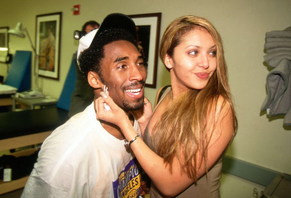  He cuddles up to then-fiancee Vanessa after his NBA Championship victory in 2000