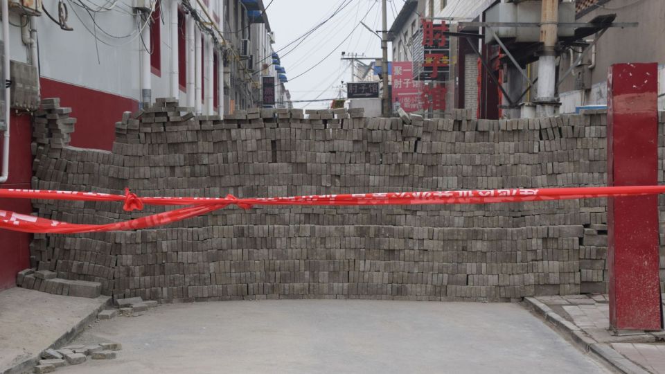  A wall in a village in Hebei province to keep out anyone with the virus