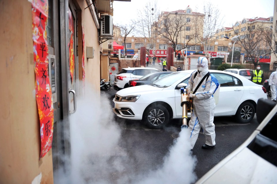  Coronavirus: A residential area of Qingdao is disinfected in a bid to stop the virus spreading