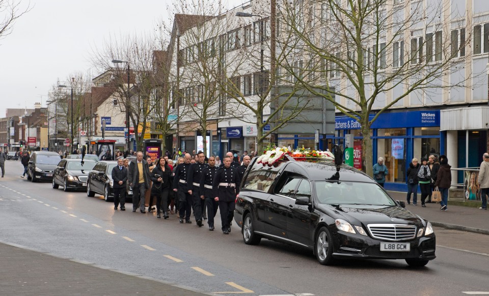  His heartbroken family and friends walked behind his coffin as it was carried down the high street