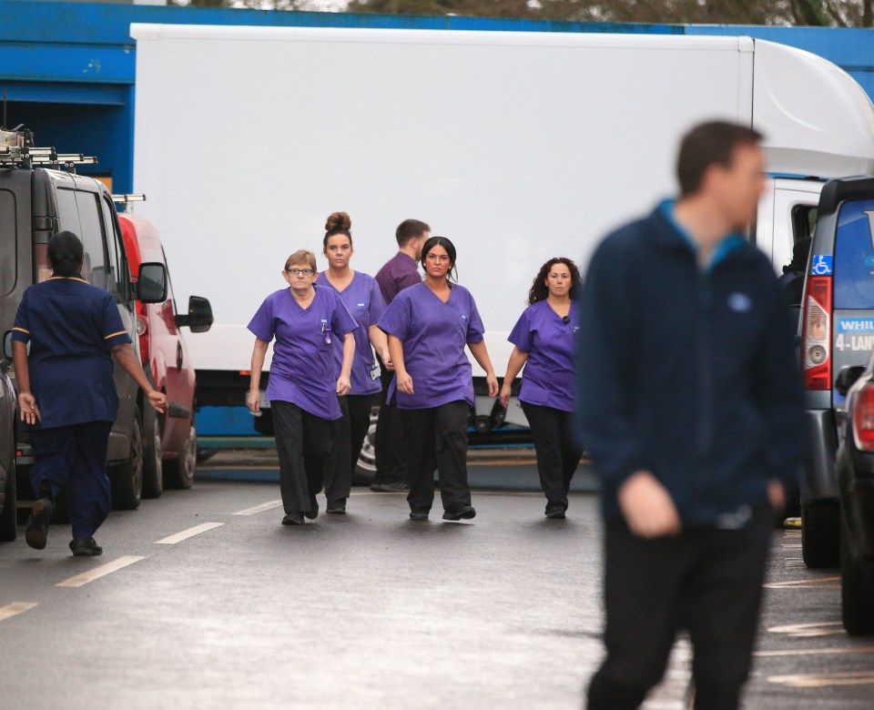 Staff at Arrowe Park Hospital in Merseyside prepare for a bus carrying British nationals from the coronavirus-hit city of Wuhan in China