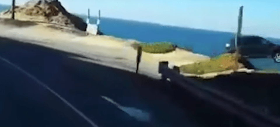  This is the moment the car drives over the cliff