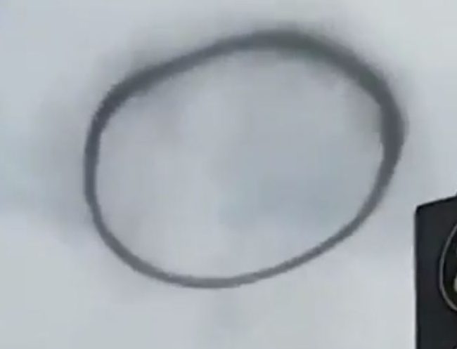 The smoke ring appeared suddenly and drifted over the Pakistani city of Lahore