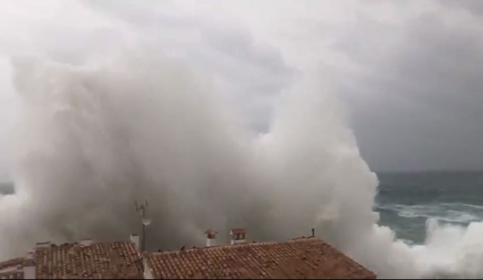  A giant wave crashes over houses in Majorca during Storm Gloria