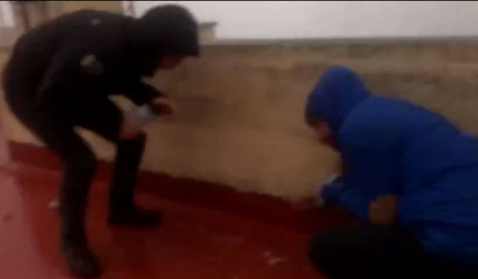  Storm spectators cower as the wall of water strikes their rooftop 100 yards inland