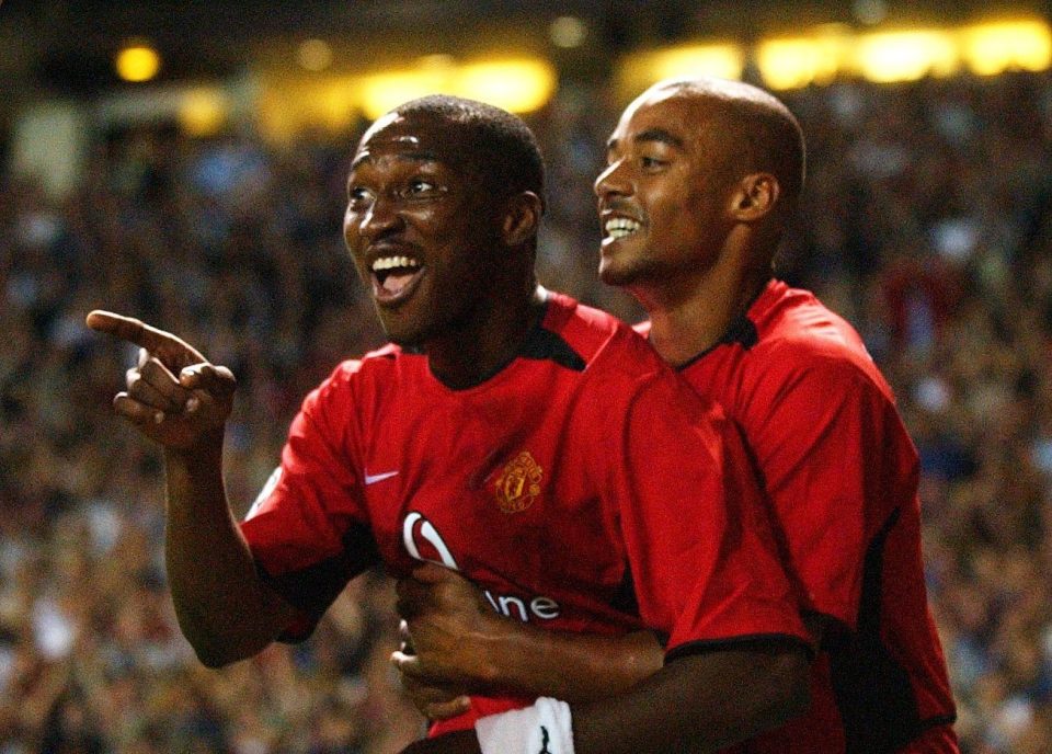  Djemba-Djemba (left) celebrates with fellow flop David Bellion