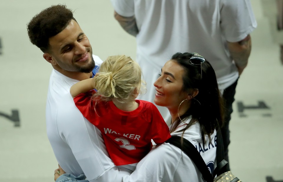  Kyle Walker hugs his wife Annie Kilner and daughter following the 2018 FIFA World Cup match between England and Croatia