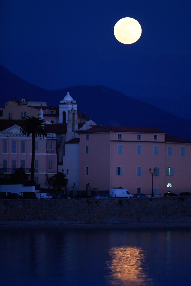 A Super Snow Moon rises over Ajaccio on the French Mediterranean island of Corsica