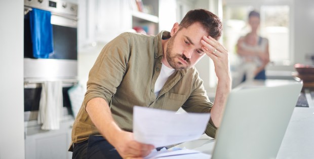 Man worried looking at bills