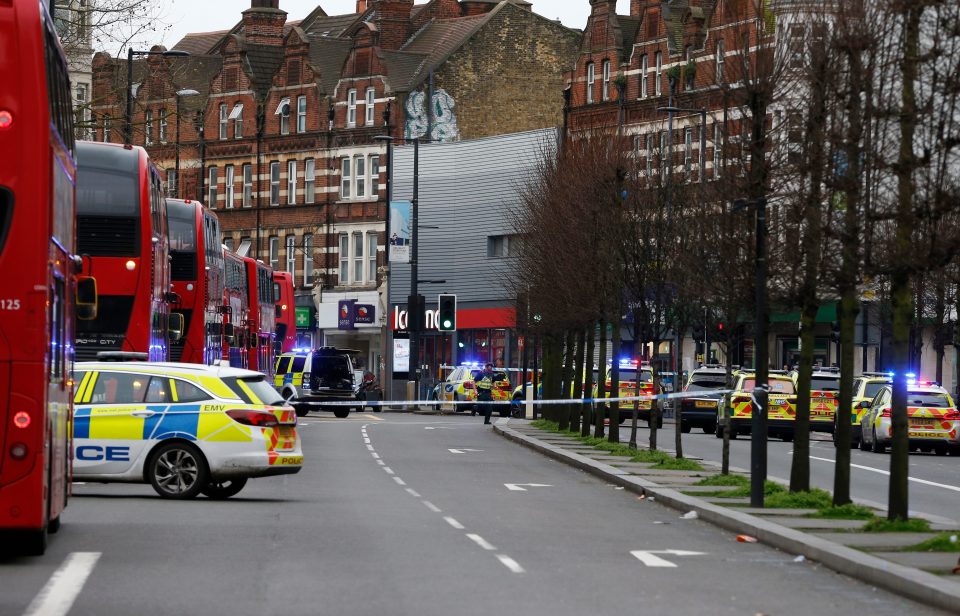  Dozens of police cars seen on the high street where buses and traffic has been stopped