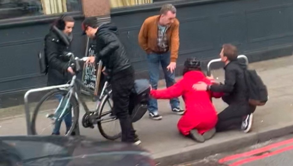 Locals help a female cyclist stabbed outside The White Lion pub