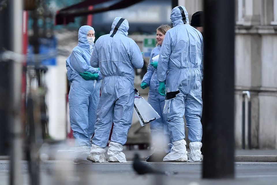  Police forensic officers work on Streatham High Road in South London today