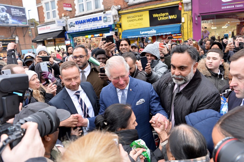 Charles stopped for a mini walkabout as he left – but was completely mobbed by members of the public