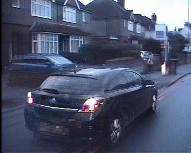  The driver was caught waiting on a no-stopping zone in order to reverse into her own drive