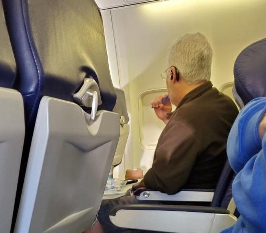  A man was spotted brushing his teeth in his seat during a flight