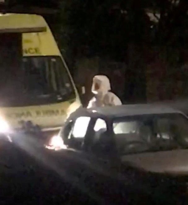  A paramedic is seen wearing a hazmat suit in York on Tuesday night - less than a mile from where last week's two cases were diagnosed