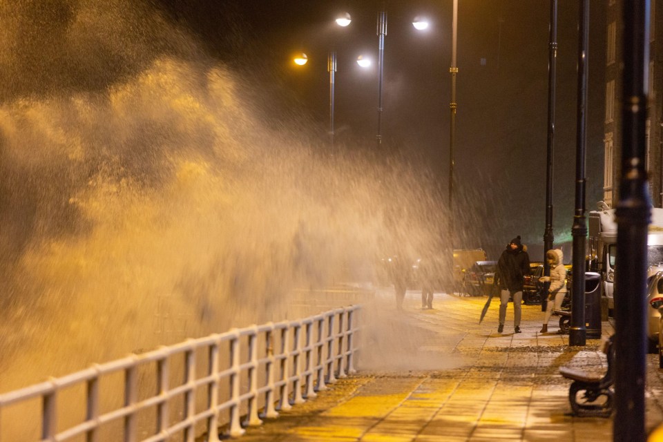 Huge waves batter the coast along the seaside town of Aberystwyth in mid Wales overnight with danger to life alerts issued for today