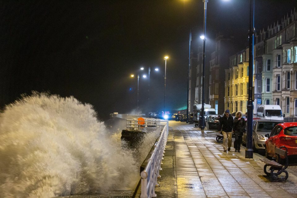  A huge wave crashes into the promenade in Aberystwyth, Wales, on Saturday night