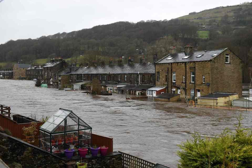  Flood water surrounds houses in Mytholmroyd, northern England