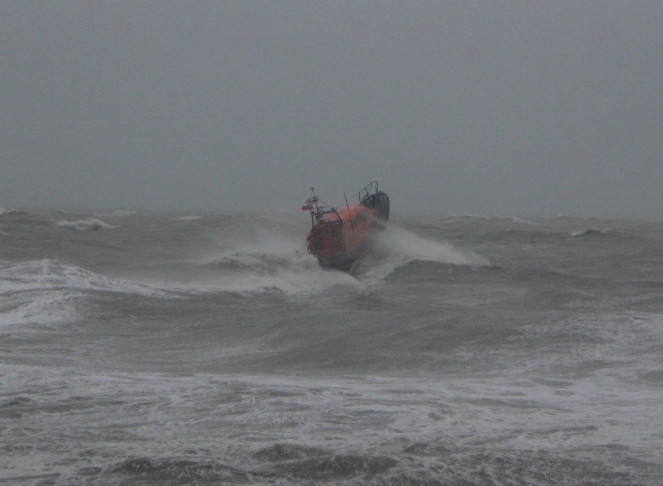 The RNLI crew head into Storm Ciara to rescue a surfer off the coast of Hastings