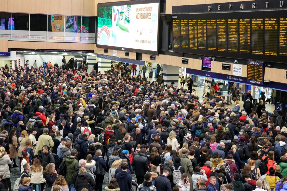  London Euston station is packed with commuters amid rail warnings