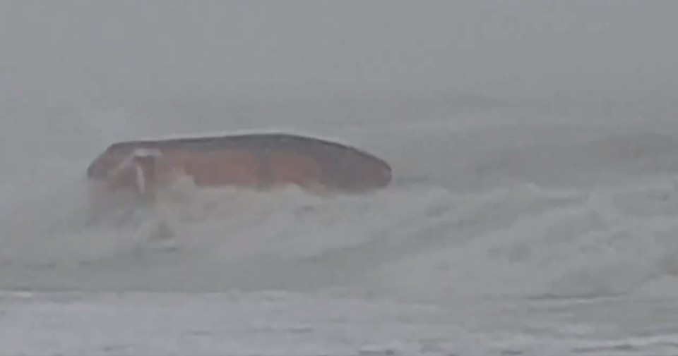 The lifeboat comes terrifyingly close to capsizing after a huge wave batters into it