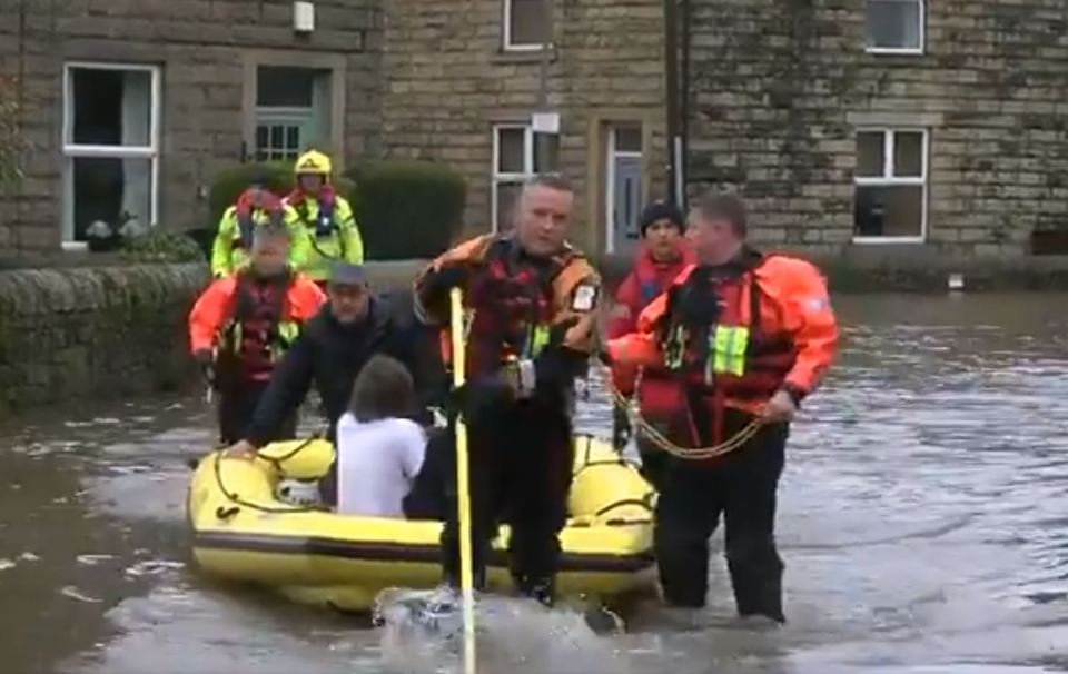  People are helped to safety from their homes in Ramsbottom, Lancs