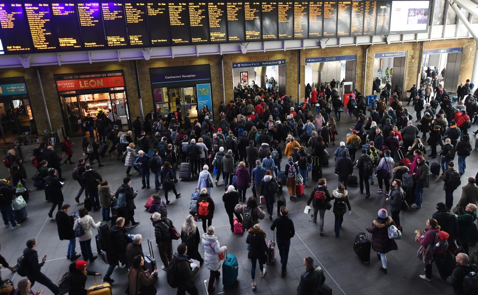  Commuters gather at King's Cross station as trains are delayed or cancelled