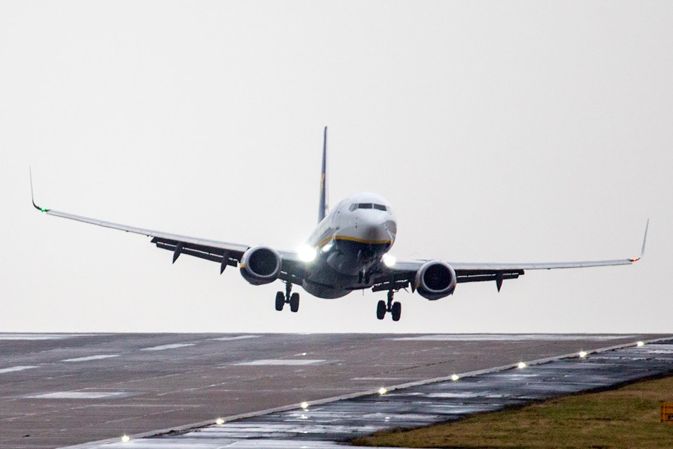  A Ryanair aircraft arriving from Gdansk struggles to land in strong winds at Leeds Bradford