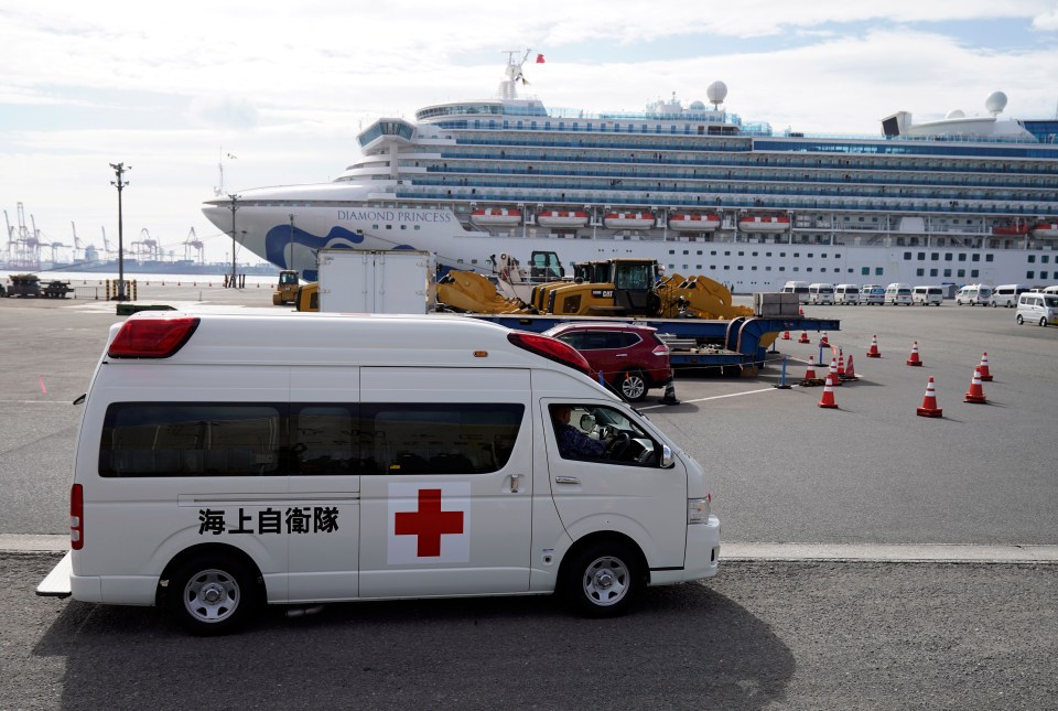  A fleet of ambulances wait to take infected cruise passengers to hospital today in Yokohama