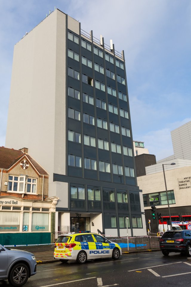  A police car can be seen parked outside the building this morning