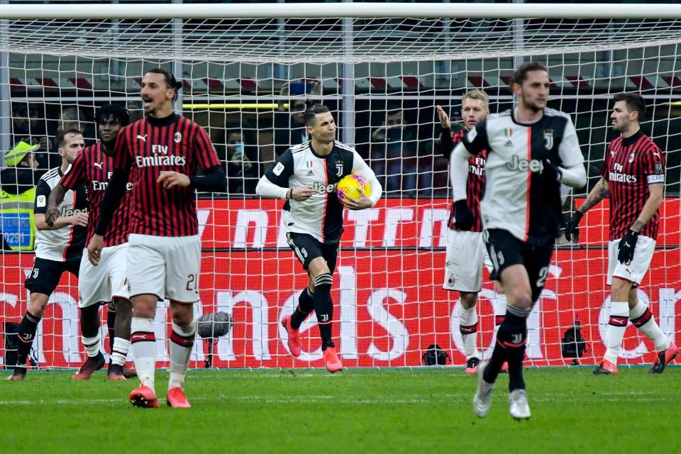  Cristiano Ronaldo trots away after his 90th minute penalty secured a 1-1 draw with AC Milan