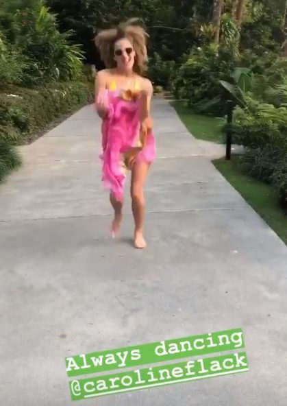 One clip showed Caroline laughing and dancing on holiday