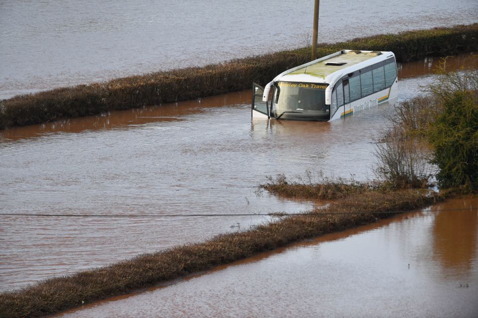  A coach submerged in floodwater from the River Teme on the A443 near Lindridge, Worcestershire