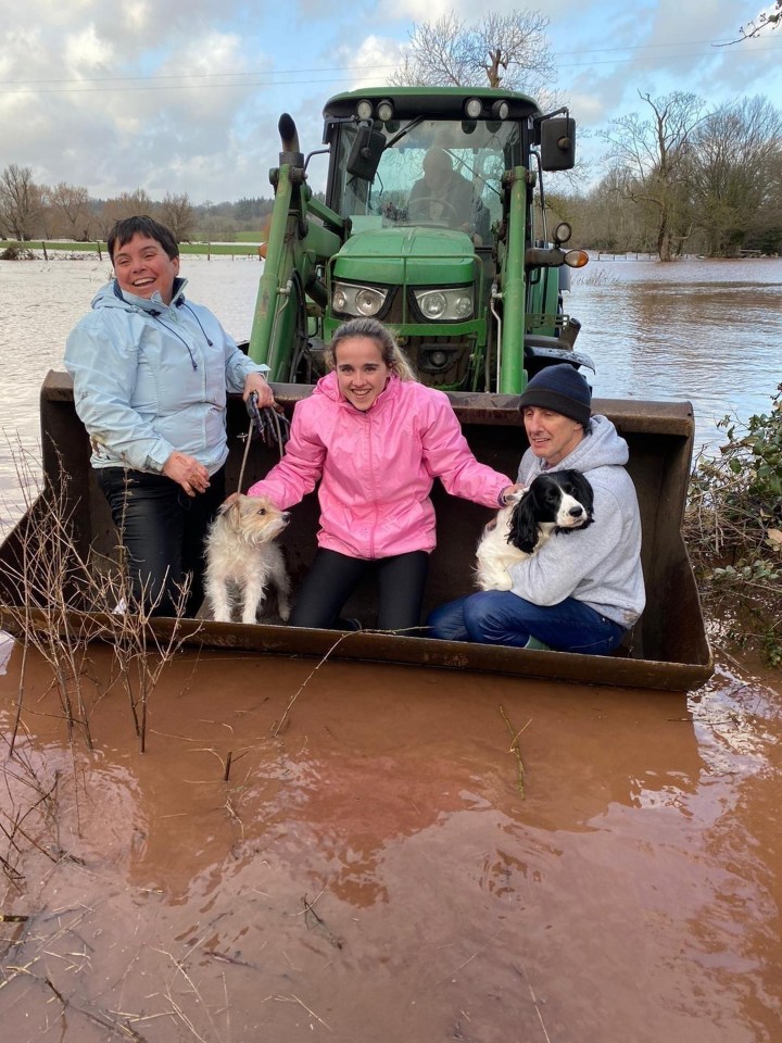  Amy Price’s family and dogs were pulled to safety in a tractor’s bucket