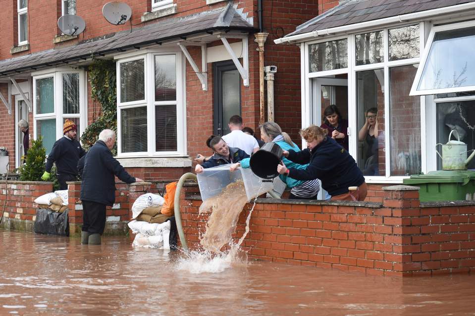  Residents in Ross-on-Wye could be seen frantically bailing water out of their flooded homes