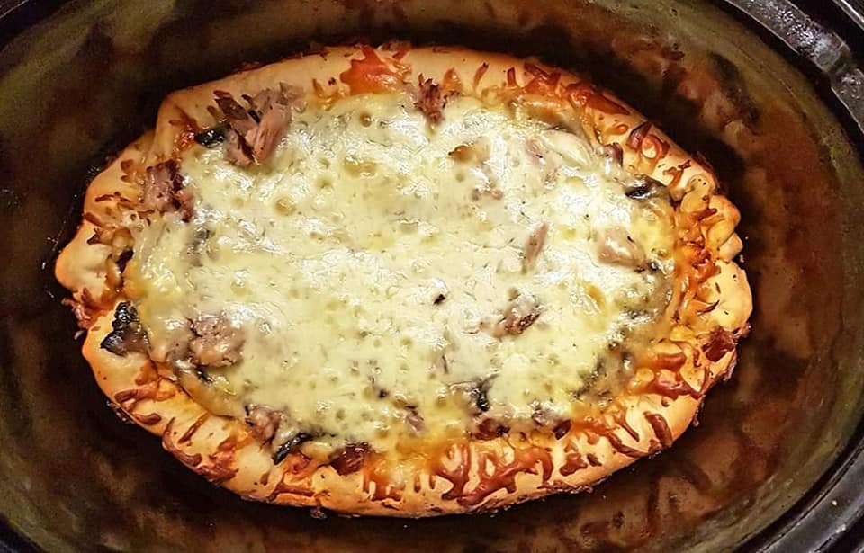 The nature of a slow cooker means that your pizza will end up in an oval shape