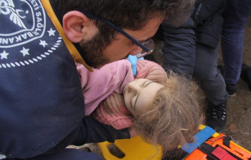  A girl is rescued from the rubble of a collapsed construction in Turkey's eastern Van province