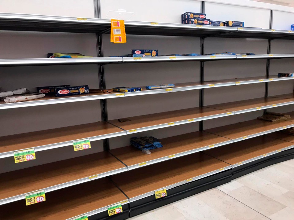  Just a few packs of pasta were left on the shelves at this store in in Rozzano, near Milan