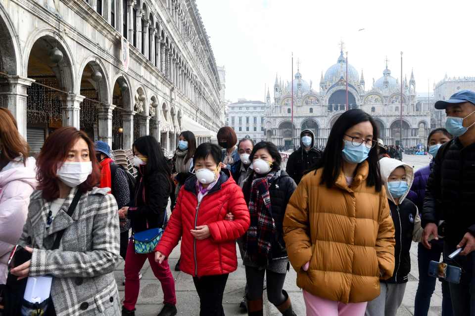  Tourists wearing protective face masks visit the Piazza San Marco, in Venice