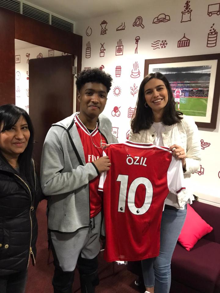  The seriously-ill teenager was presented with an Ozil shirt by the footballer's wife Amine Gulse in the VIP box