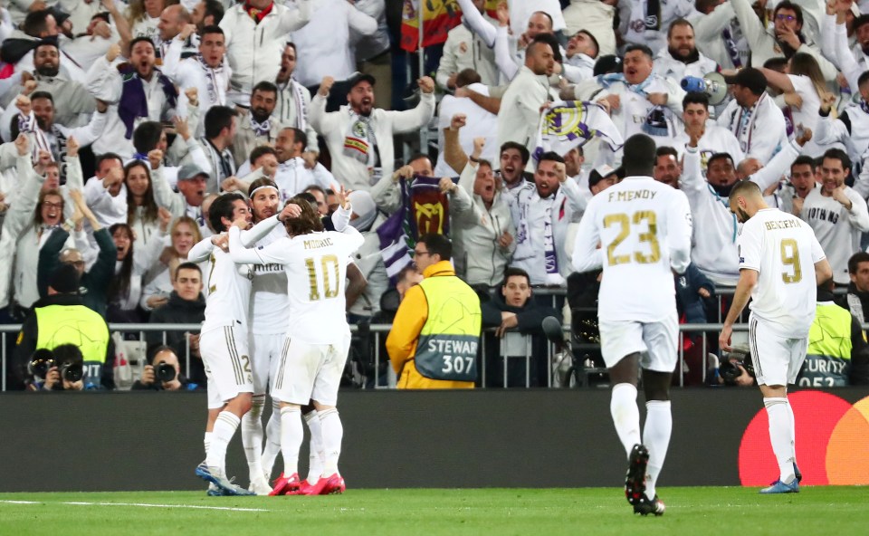  Real Madrid celebrate their opening goal at the Bernabeu