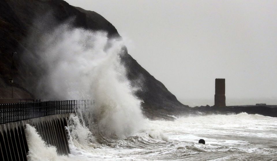  Large waves crash over the promenade in Folkestone, Kent