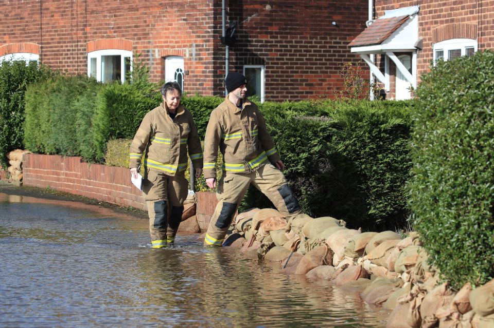  Firefighters helped East Cowick locals to use sandbags as flood barriers