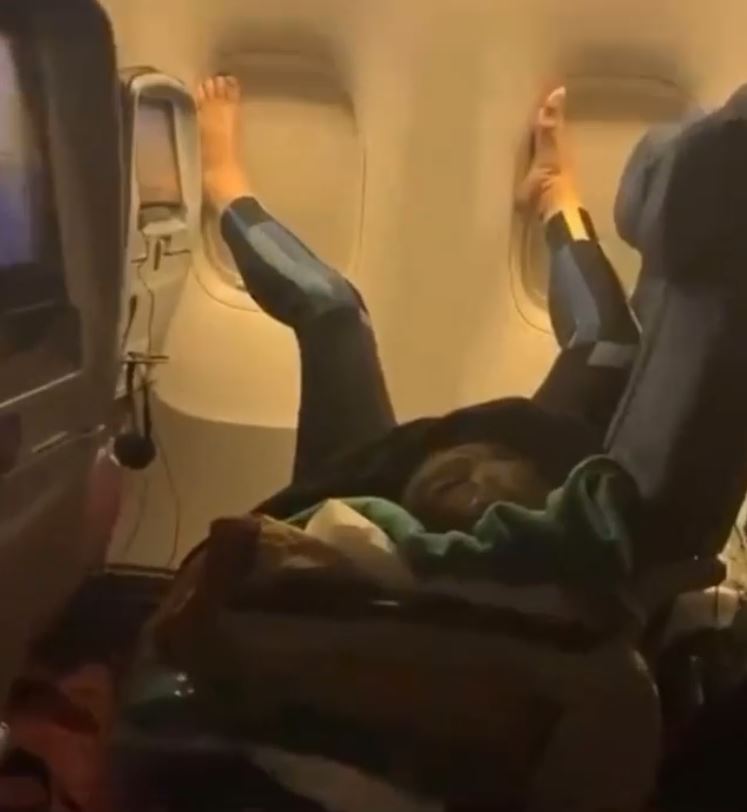  The passenger was seen with her feet propped up against the plane window