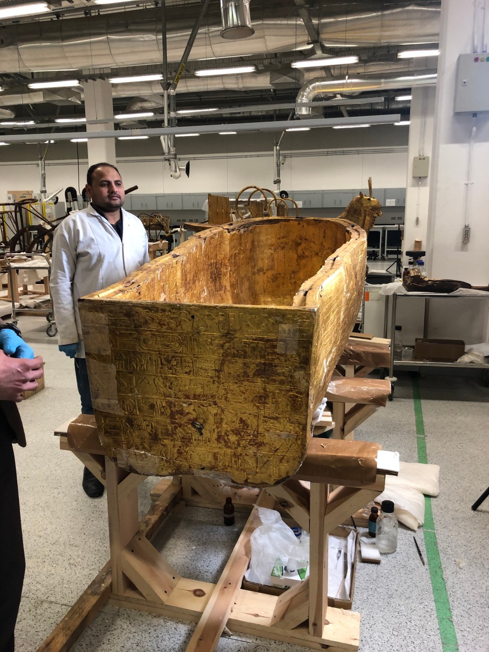  The coffin is being carefully restored using small pieces that have fallen off it