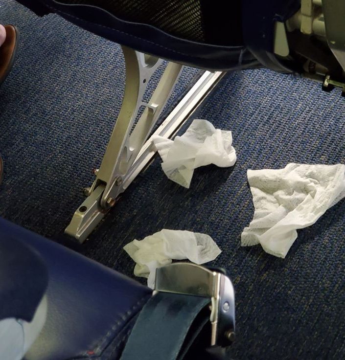  A passenger was caught wiping down his chair using sanitiser wipes - before throwing them on the floor